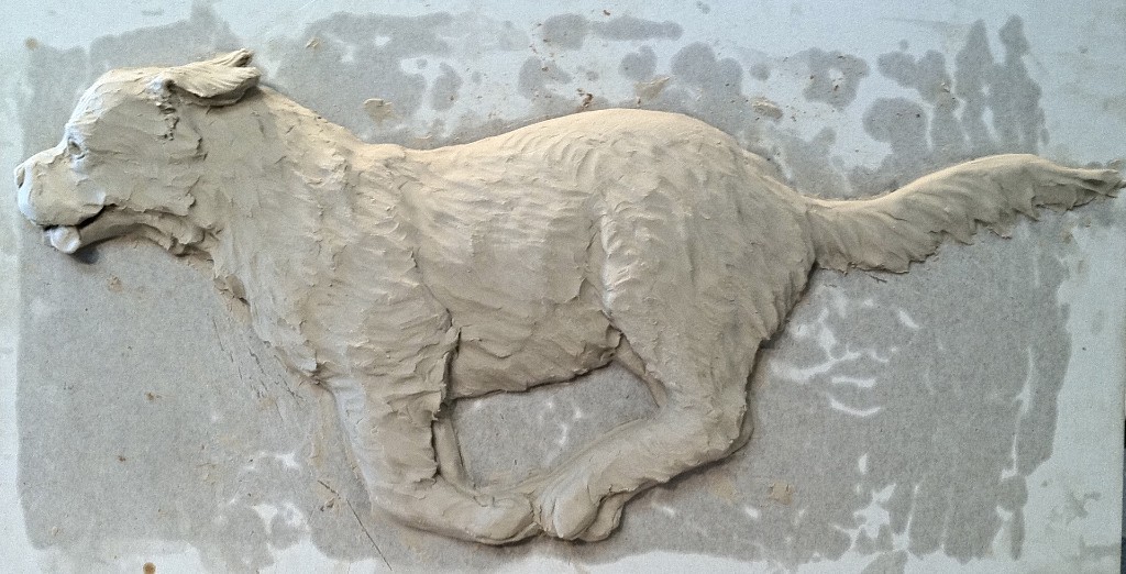Clay bas relief sculpture
